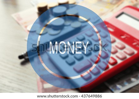 Money sign. Red calculator with banknotes and coins on wooden table