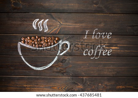 cup of coffee drawn with chalk on the old vintage wooden board. Coffee beans and text Iove coffee