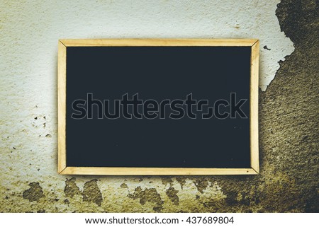 blackboard on white background on peeled color wall background