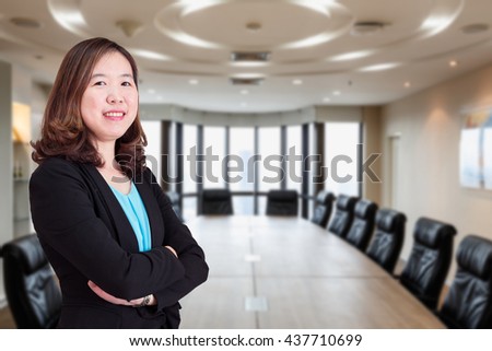 Asian business woman. on background. Business meeting room in office.