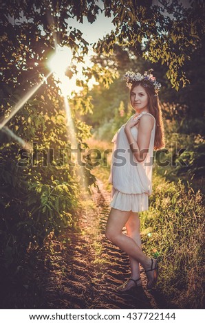 girl in the forest at sunset