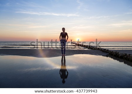 portrait of a teenage girl on the beach at sunset