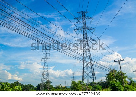 Many high voltage electric pole with blue sky, vertical picture