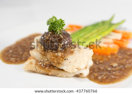Dory steak with garlic pepper sauce.
