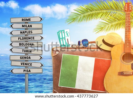 Concept of summer traveling with old suitcase and Italy town sign