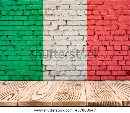 Italy flag painted on brick wall with wooden floor