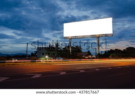 Blank billboard for advertisement at twilight.Street lighting