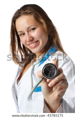 Smiling beautiful doctor with stethoscope on a  white background. Medical concept. Selective focus.
