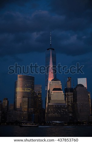 New York City at dusk under dark, purple sky