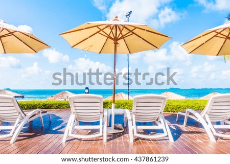 Beautiful luxury umbrella and chair around outdoor swimming pool in hotel resort - Holiday Vacation concept for background