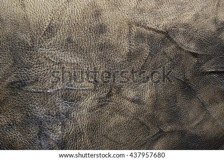 Background made from cow leather, suitable for modeling and fashion industry. Close-up