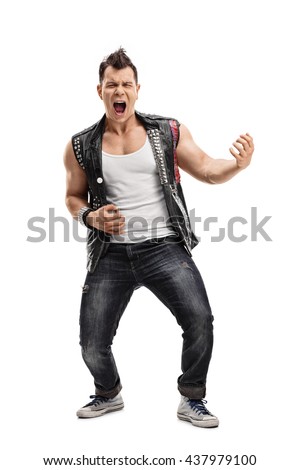 Full length vertical shot of a young punk rocker playing an air guitar isolated on white background Royalty-Free Stock Photo #437979100