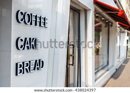 Restaurant cafe with door and window. Caption letters coffee, cake, bread