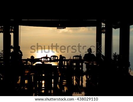 Picture of Silhouette, man sit and watch a sunset