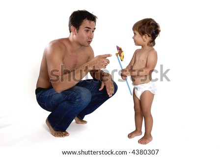 Picture of happy family - father with daughter play with pinwheel