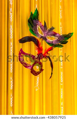 Mask floating on stage and gold curtain background and copy space./ Classical mask  floating on stage of life.