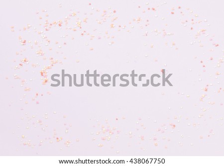 Colorful tiny topping ball on pink background.