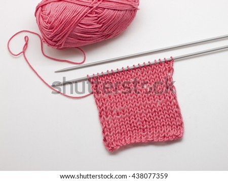 Stocking st, two knitting needles, yarn pink