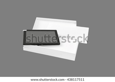 Tablet PC in new packaging. Isolated on a gray background.