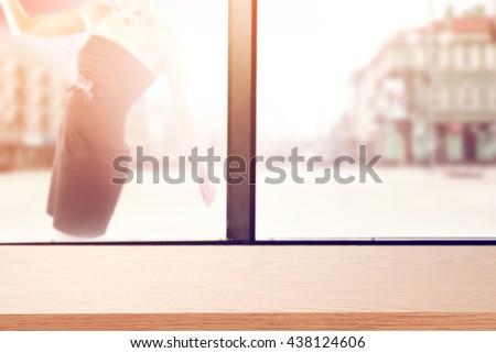 wooden plank with a window and black dres