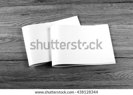Blank brochure on wooden background