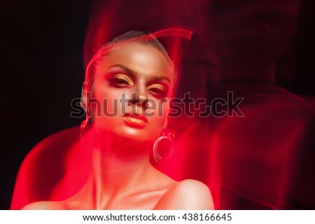 Art fashion make up photo. Woman with fire type flames arround her. Beauty and fashion. High end image
