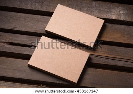 recycled paper business cards on wooden background