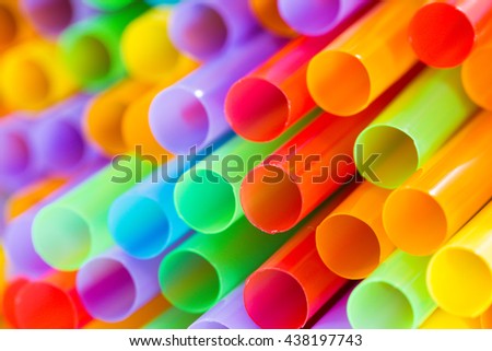 Colorful plastic drinking straws, close up as background