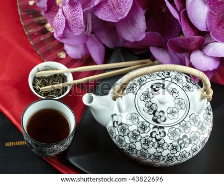 Chinese tea in a red deco atmosphere with orchids (large format photography)