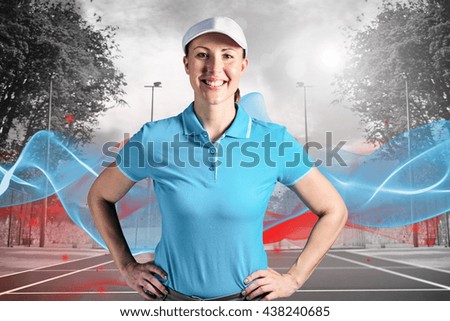 Sportswoman posing on black background against composite image of tennis field on a sunny day