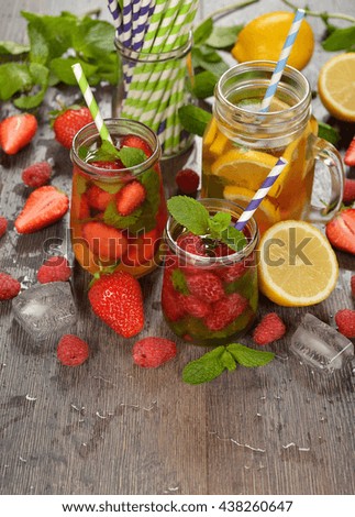 Cold fruit tea on a wooden background