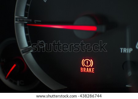 Brake light signal icon on the car panel, Close-up and Soft-focus