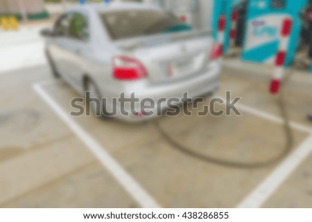 Abstract blurred car at the gas station.