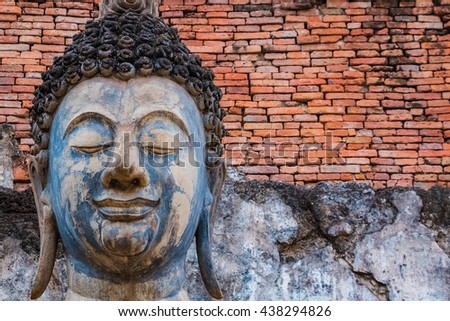 Old Buddha statue at Sukhothai historical park(selective low key picture style), Thailand,Sukhothai