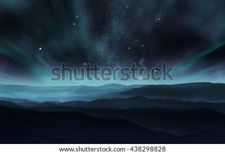 Starry night sky with aurora over the hills Royalty-Free Stock Photo #438298828