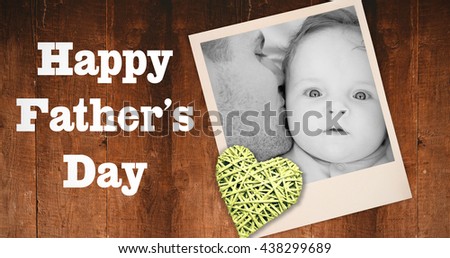 Father opening gift given by children against overhead of wooden planks