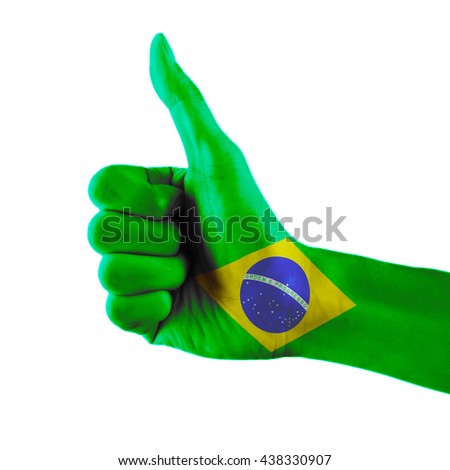 Brazil flag painted hand showing thumbs up sign on isolated white background with clipping path