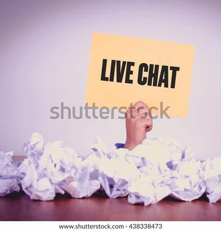 HAND HOLDING YELLOW PAPER WITH LIVE CHATCONCEPT