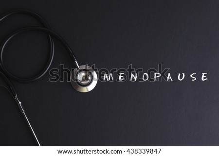 MENOPAUSE word with stethoscope - health concept. Medical conceptual