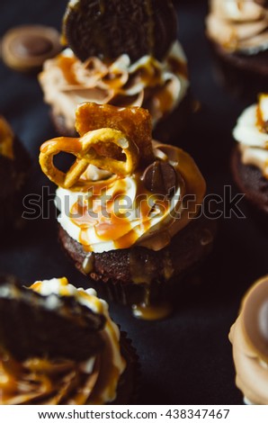 Homemade Chocolate and salt caramel Cupcake with chocolate mascarpone,, frosting against a dark background