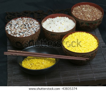 Colorful rice set detail on black background (large format photography)