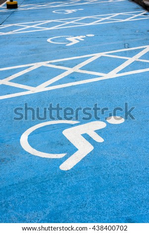 handicapped parking sign on the cement floor