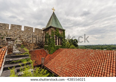Belgrade fortress and old church with garden in the sunset