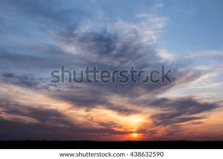 Colorful sunset with clouds in the evening