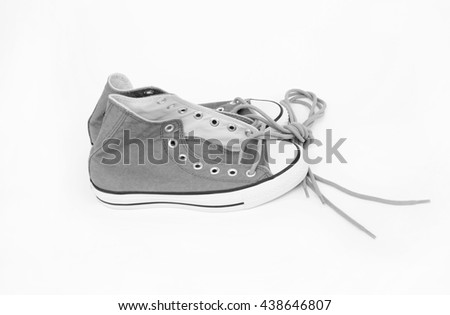 Pair of new sneakers isolated on white background, black and white style image