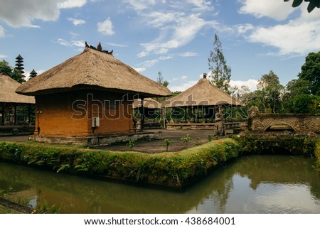 Temple houses surrounded by water,  Indonesia Royalty-Free Stock Photo #438684001