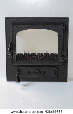 iron cast fireplace black door isolated on white background, fireplace screen. 