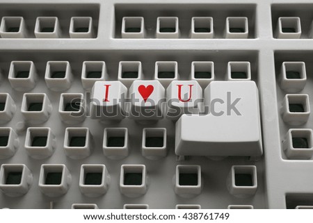 Keyboard close-up, without many keys. Three buttons with inscription "I love you" and Enter.
