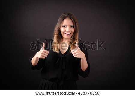 Beautiful woman doing different expressions in different sets of clothes: thumbs up