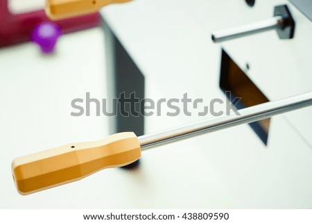 Close up Yellow Handle steel rod in Table football.Management Concept.